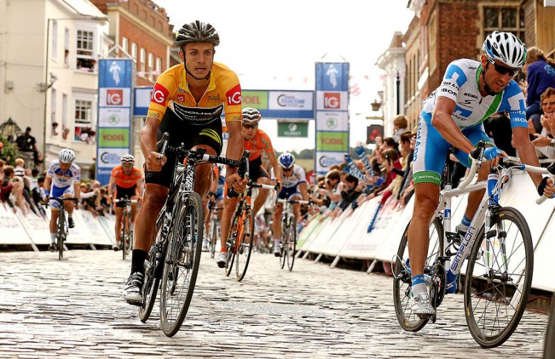 Riders pass through Guildford High Street during the 1st passage of the final stage of the Tour of Britain on September 16, 2012 in Guildford, England.