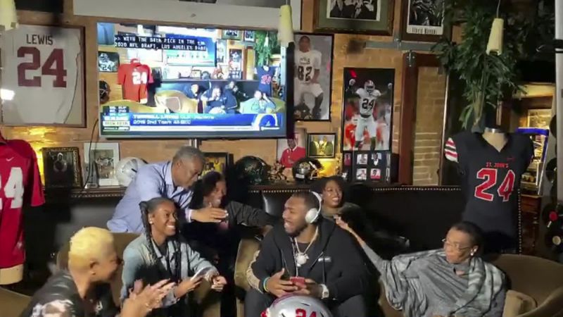 Terrell Lewis, center, is congratulated being selected by the Los Angeles Rams during the third round of the 2020 NFL draft. (Photo by NFL via Getty Images)